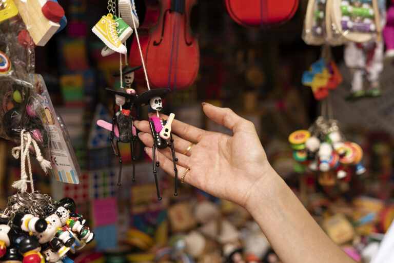 side view hand holding souvenir